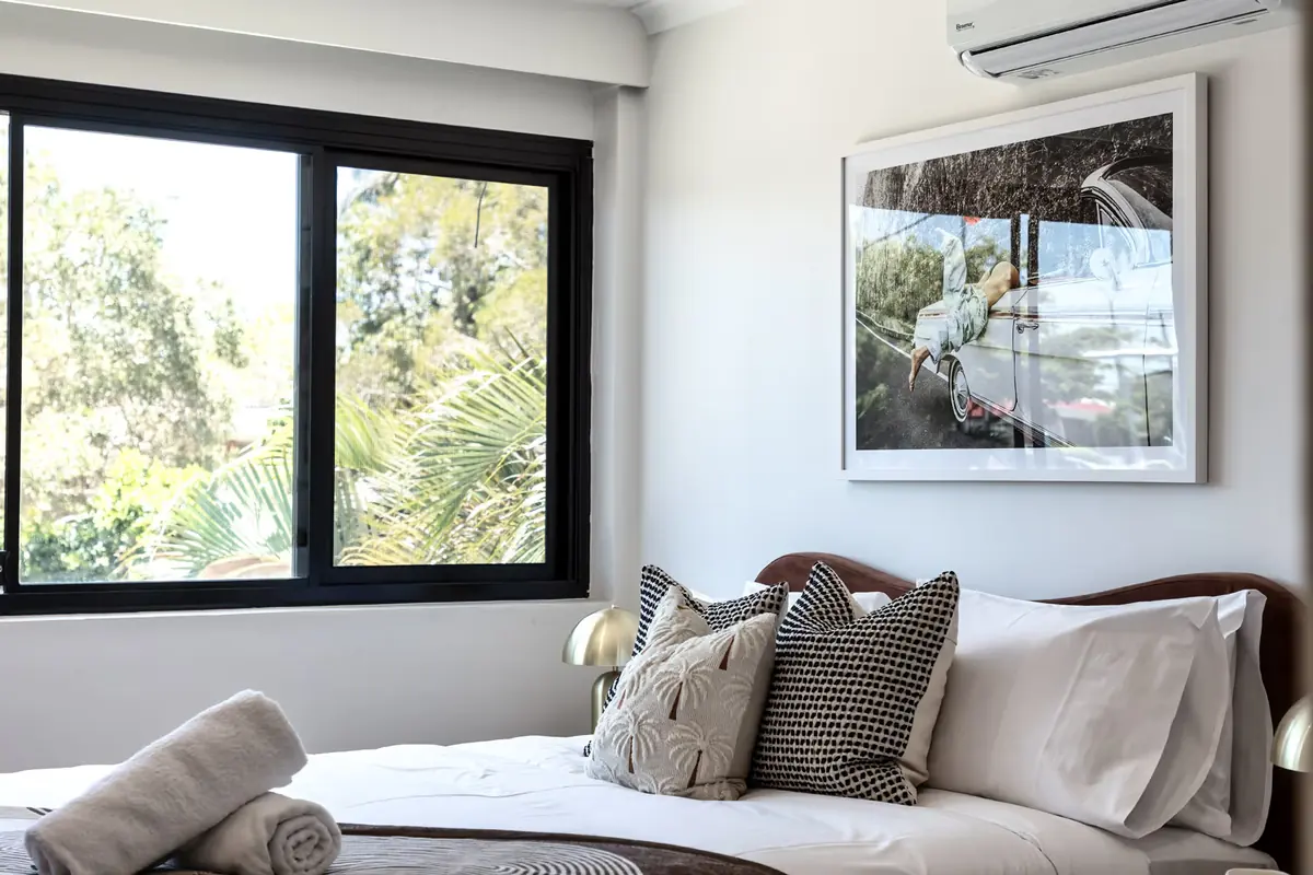 Bedroom with a queen bed and a garden outlook in a two bedroom unit at Miami Motel